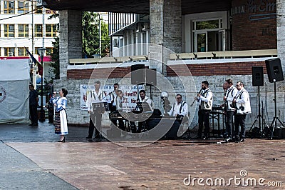 Professional dancers in folk costume from ,TÃ¢rgu Ji. 2 Editorial Stock Photo