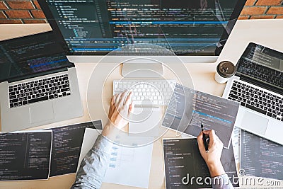 Professional Developer programmer working a software website design and coding technology, writing codes and database in company Stock Photo