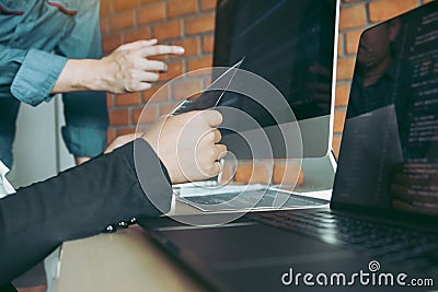 Professional development programmer cooperating meeting programming website working a software in office room Stock Photo