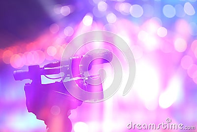 Professional digital video camera in concert light. Stock Photo