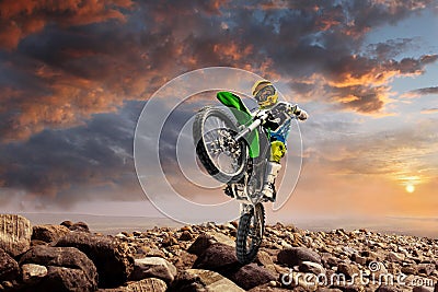 Professional dirt bike rider doing wheely Stock Photo