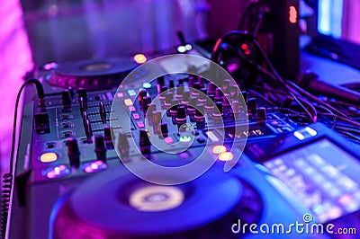 Professional DJ Equipment sound and audio mixer control panel with buttons and sliders Stock Photo