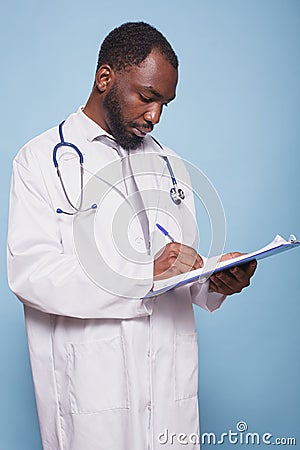 Professional doctor writes medical notes Stock Photo