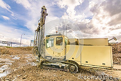 Professional drilling rig doing a geotechnical study of the terrain Stock Photo