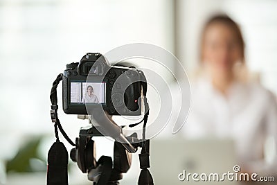 Professional dslr digital camera filming vlog of business woman Stock Photo