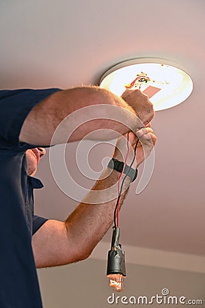 Professional electrician testing electricity current Stock Photo