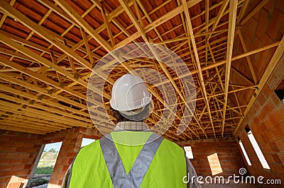 Professional engineer architect worker with protective helmet at house building construction site background Stock Photo