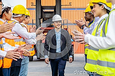 Professional Engineering and worker team congratulated success by applaud their jubilant leader after construction project Stock Photo