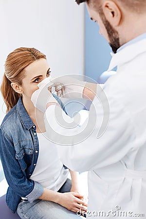 Professional experienced doctor looking at his patient Stock Photo