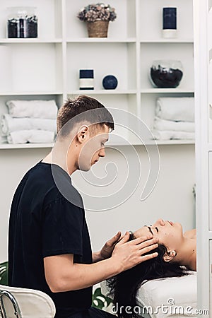 Professional face and head massage Stock Photo