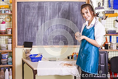 Professional Female Ceramist During Clay Preparation on Table in Workshop Stock Photo