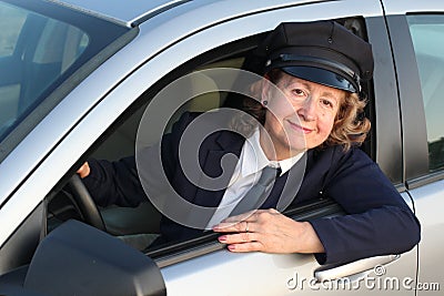 Professional female chauffeur wearing formal uniform Stock Photo