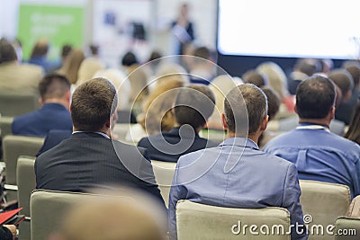 Professional Female Host Speaking in Front of the Large Audience During Business Conference Editorial Stock Photo