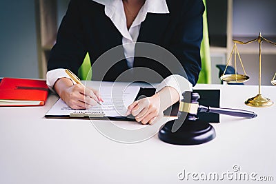 Professional female lawyers working at the law firms. Judge gave Stock Photo