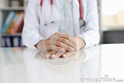 Professional general practitioner or cardiologist sits at table Stock Photo