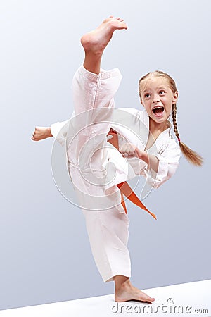 Professional girl does karate kick Stock Photo