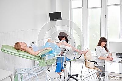 Professional gynecologist examining her patient Stock Photo