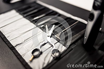 Professional haidresser tools on table with close-up of scissors Stock Photo
