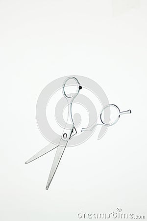 Professional Haircutting Scissors levitation. Professional hairdressers equipment. Steel hairdresser shears. Accessories for Stock Photo