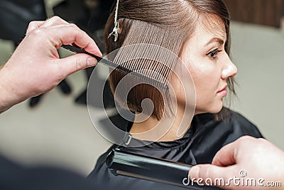Hair salon. Woman haircut. Cutting Stock Photo