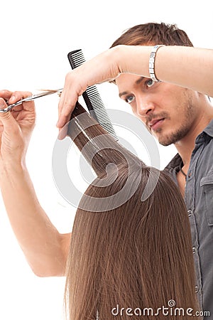 Professional hairdresser with long hair model Stock Photo