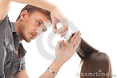 Professional hairdresser with long hair model Stock Photo