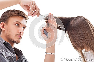 Professional hairdresser with long hair model Stock Photo