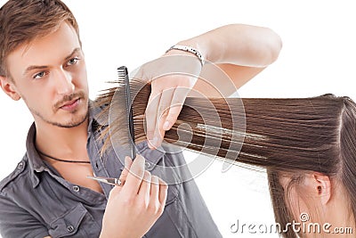 Professional hairdresser with long hair model Stock Photo