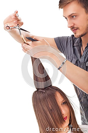 Professional hairdresser with long hair model Stock Photo