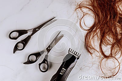 Professional hairdresser scissors on electric hair clipper Stock Photo