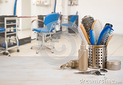 Professional hairdresser tools on table over defocused salon interior background Stock Photo