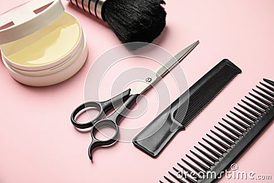 Professional hairstyling tools on pink background Stock Photo