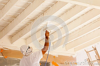 Professional House Painter Wearing Facial Protection Spray Paint Stock Photo