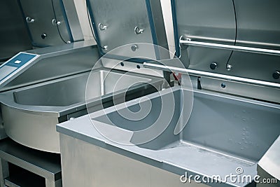 Professional kitchen steel equipment for food preparing. Toned Stock Photo