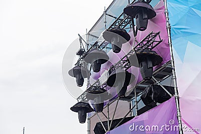 Professional lighting equipment high above an outdoor concert scene Stock Photo