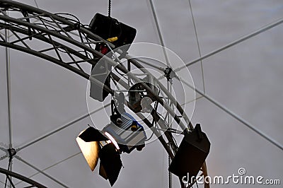 Professional lighting equipment near ceiling of theater stage. Stock Photo