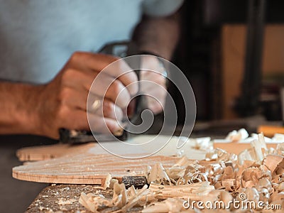 Professional luthier violinmaker artisan working on making a handmade violin with ancient tradtitional Stradivarius craftmanship Editorial Stock Photo