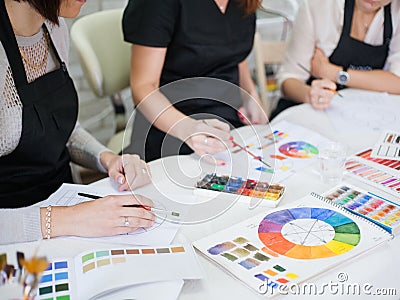 Professional makeup courses ladies studying colors Stock Photo