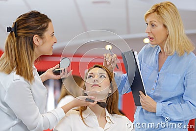 Professional makeup teacher training student girl Stock Photo