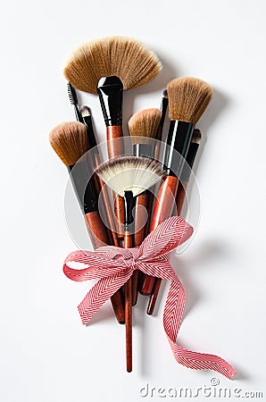 Professional makeup tools brushes on a pastel pink background. magazines, social media. Top view. Flat lay Stock Photo