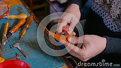 Skinner working with leather belt Stock Photo