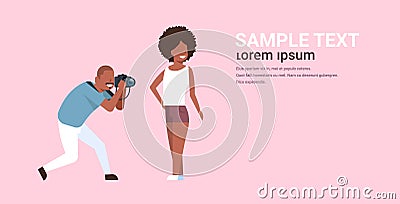 Professional man photographer using camera shooting african american sexy woman model girl posing modern photo studio Vector Illustration