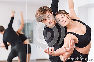 Professional masterful dancers looking at the hands Stock Photo