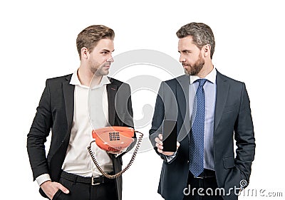 Professional men hold telephone and mobile phone isolated on white, communications Stock Photo