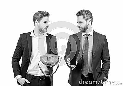 Professional men hold telephone and mobile phone isolated on white, communications Stock Photo