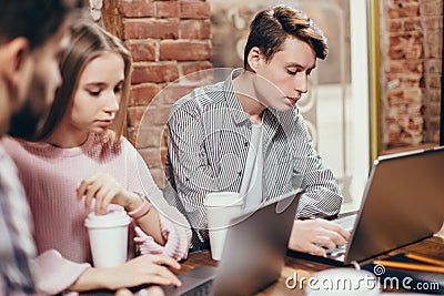 Professional men and woman freelancers working together on project for IT corporation collaboration to finishing before deadline s Stock Photo