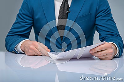Professional newscaster reading his papers Stock Photo