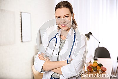 Professional nutritionist with stethoscope in office Stock Photo