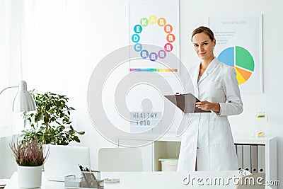 Professional nutritionist in white uniform Stock Photo