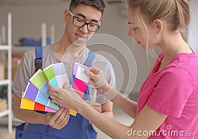 Professional painters choosing the color of wall indoors Stock Photo